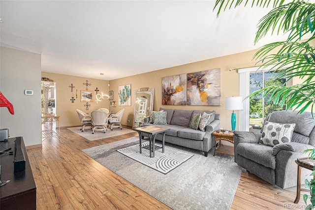 4541 W Ponds Cir, Littleton, CO 80123 - living area with light wood-type flooring and a chandelier