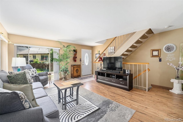 4541 W Ponds Cir, Littleton, CO 80123 - living room with light wood-style floors and stairs