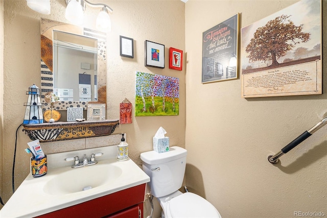 4541 W Ponds Cir, Littleton, CO 80123 - bathroom with vanity and a textured wall