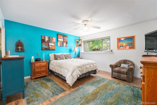 4541 W Ponds Cir, Littleton, CO 80123 - bedroom with wood finished floors and a ceiling fan