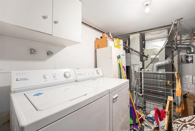 4541 W Ponds Cir, Littleton, CO 80123 - laundry area with cabinet space, washer and clothes dryer, and gas water heater