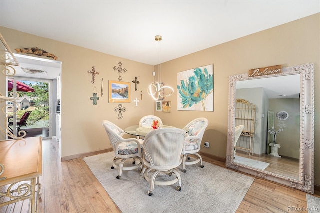 4541 W Ponds Cir, Littleton, CO 80123 - dining space featuring wood finished floors and baseboards