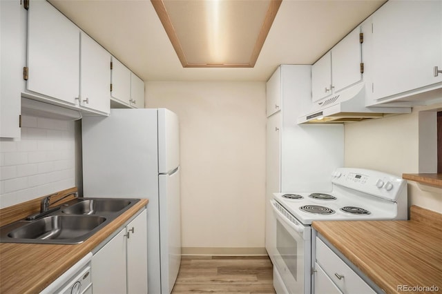 kitchen featuring a sink, tasteful backsplash, white cabinetry, white appliances, and light wood-style floors