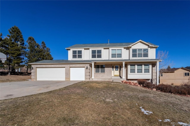 view of front property with a garage and a front lawn