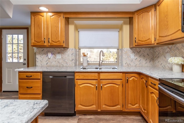 kitchen featuring tasteful backsplash, dishwasher, sink, light stone counters, and electric stove