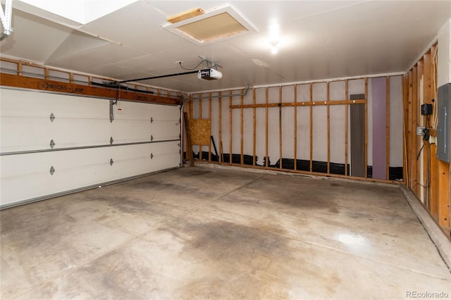 garage featuring a garage door opener and electric panel