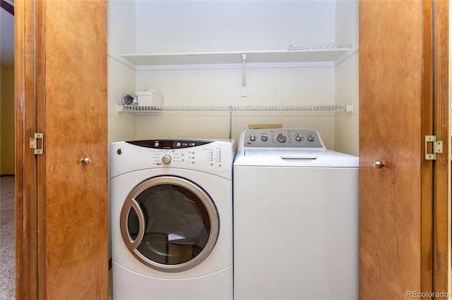 washroom with independent washer and dryer