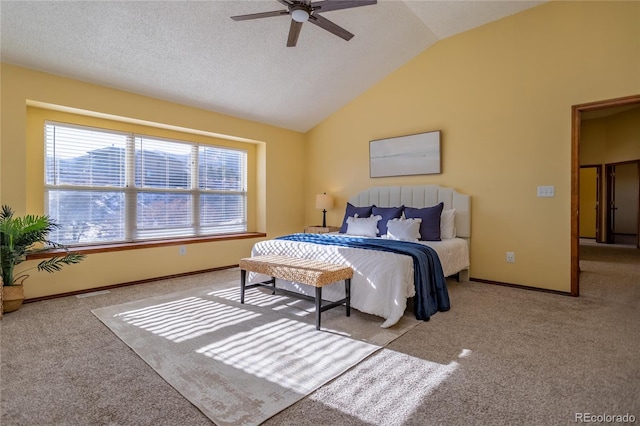 carpeted bedroom featuring lofted ceiling, a textured ceiling, and ceiling fan