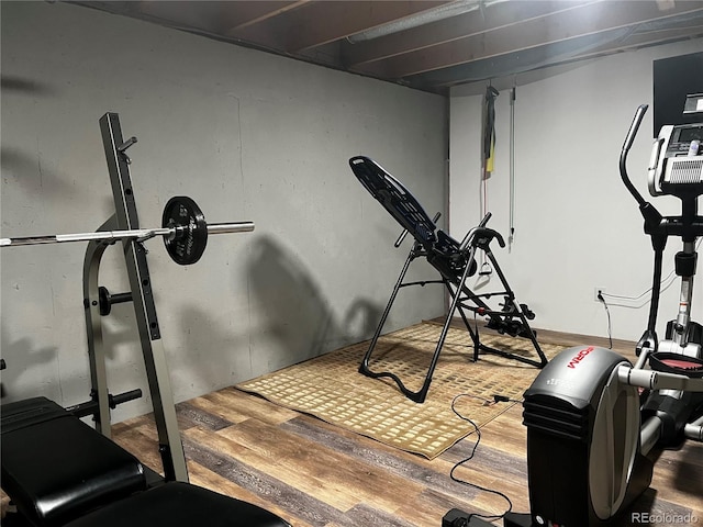 exercise room featuring hardwood / wood-style floors