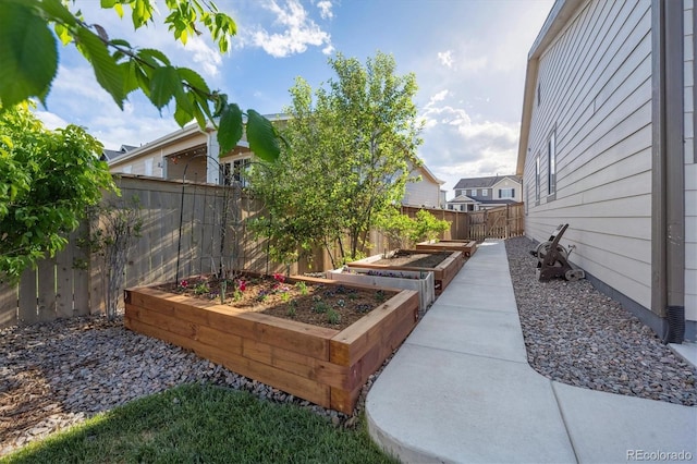 27957 E 9th Dr, Aurora, CO 80018 - fenced backyard with a vegetable garden