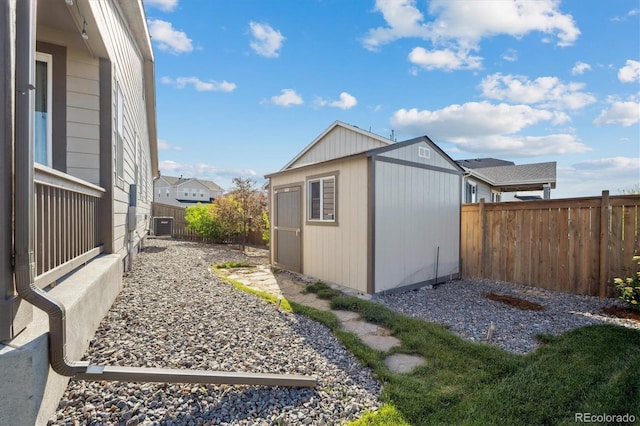 27957 E 9th Dr, Aurora, CO 80018 - view of shed featuring a fenced backyard and cooling unit