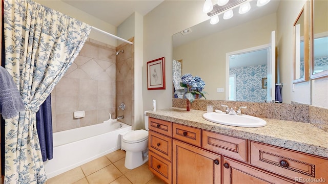 full bath featuring vanity, tile patterned flooring, toilet, and shower / tub combo with curtain