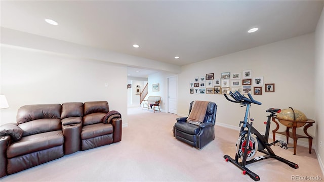 living area featuring recessed lighting, stairs, baseboards, and light colored carpet