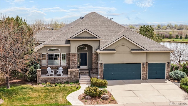 ranch-style house featuring a garage, driveway, stone siding, and stucco siding