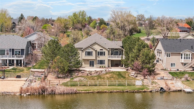 bird's eye view featuring a water view and a residential view