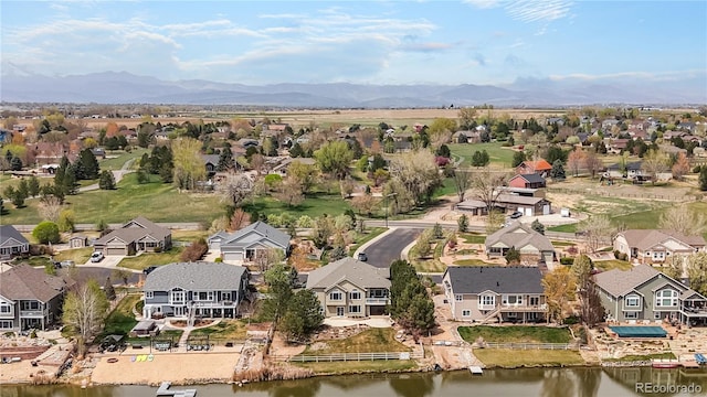 birds eye view of property featuring a residential view and a water and mountain view