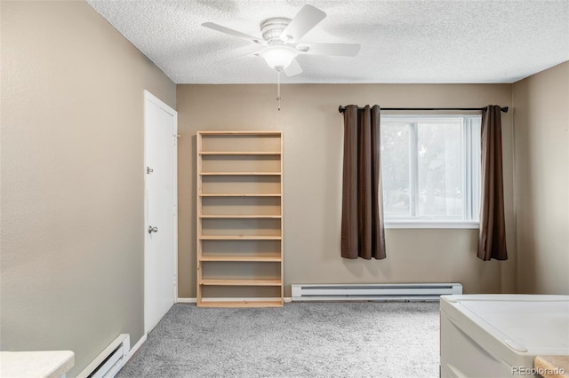 8100 W Quincy Ave Unit K3, Littleton, CO 80123 - unfurnished bedroom with a baseboard heating unit, carpet floors, a textured ceiling, ceiling fan, and a spacious closet