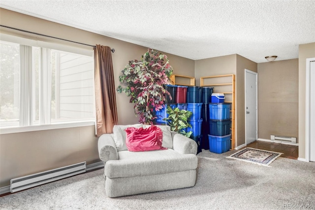 8100 W Quincy Ave Unit K3, Littleton, CO 80123 - sitting room with a baseboard radiator, plenty of natural light, carpet, and a textured ceiling
