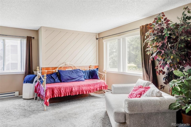 8100 W Quincy Ave Unit K3, Littleton, CO 80123 - bedroom with carpet floors, a textured ceiling, and a baseboard radiator