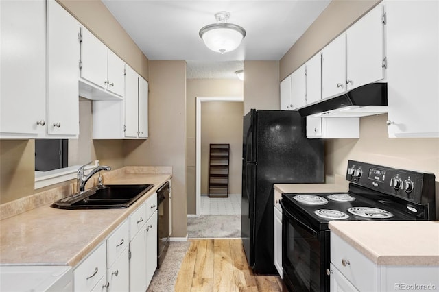 8100 W Quincy Ave Unit K3, Littleton, CO 80123 - kitchen featuring black appliances, under cabinet range hood, light wood-style flooring, white cabinetry, and light countertops