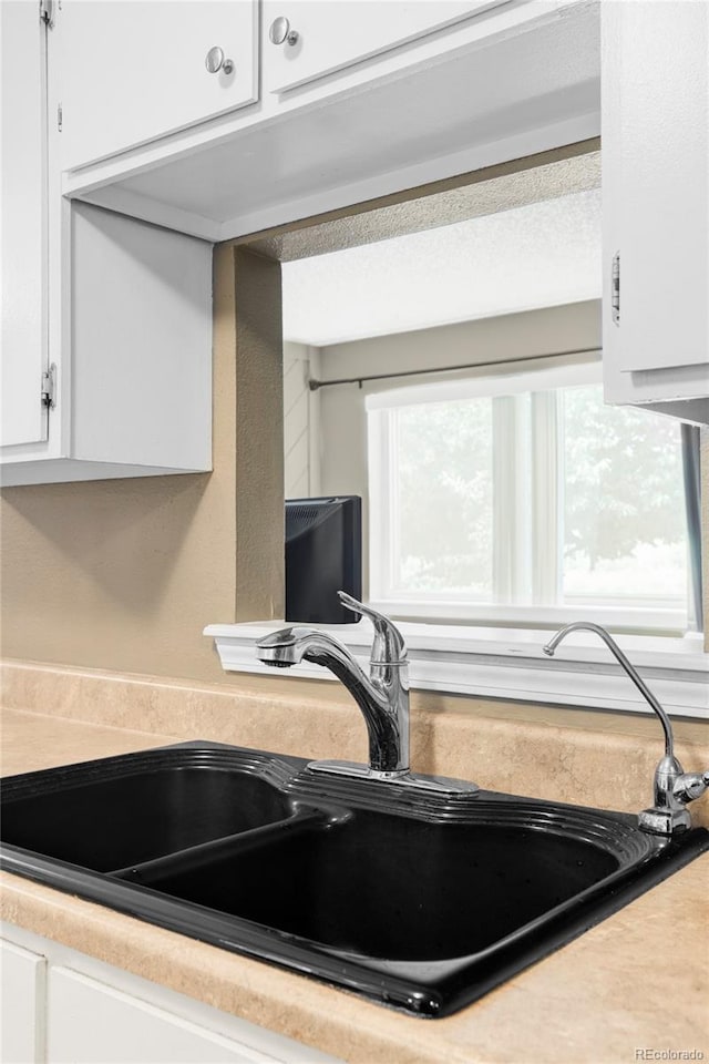 8100 W Quincy Ave Unit K3, Littleton, CO 80123 - kitchen view of white cabinetry and light countertops