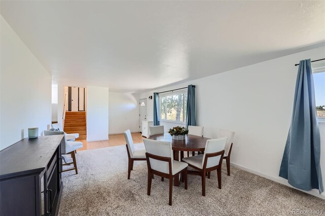 dining area with stairway and baseboards