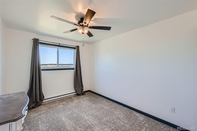 spare room with carpet floors, a baseboard radiator, baseboards, and ceiling fan