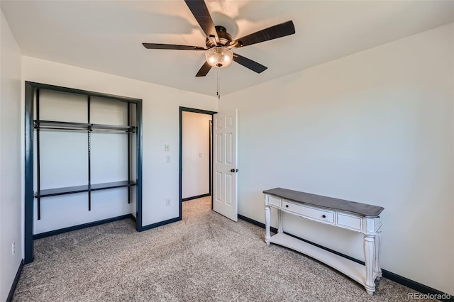 unfurnished bedroom with baseboards, ceiling fan, and light carpet