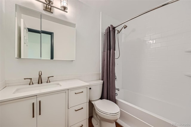 full bathroom featuring shower / bath combination with curtain, vanity, and toilet