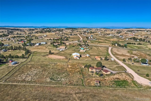 bird's eye view with a mountain view and a rural view