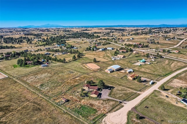 aerial view with a mountain view and a rural view