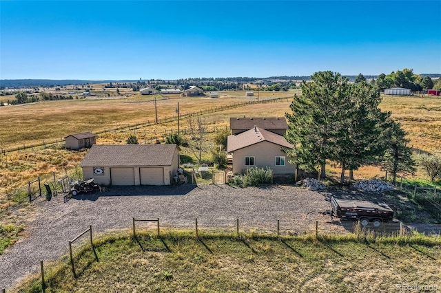 birds eye view of property featuring a rural view