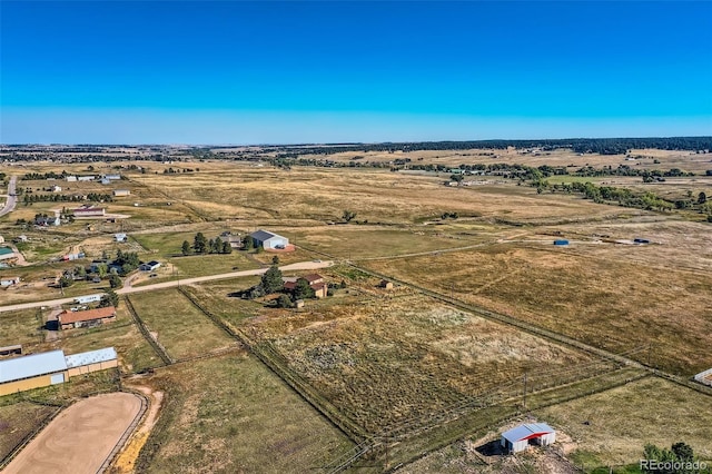 birds eye view of property with a rural view