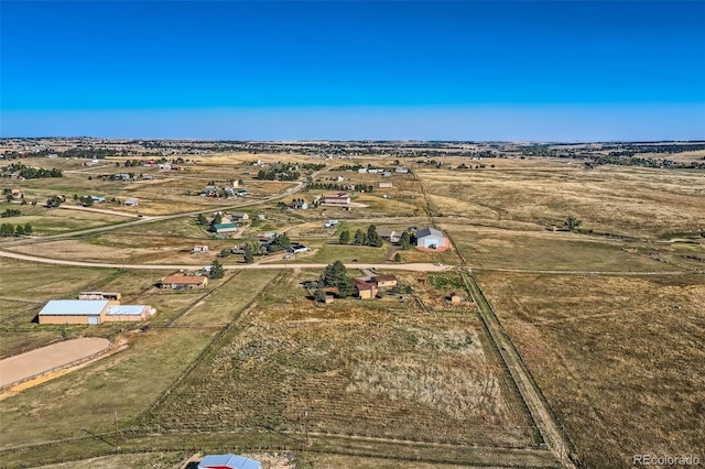 birds eye view of property with a rural view