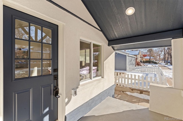 view of snow covered property entrance