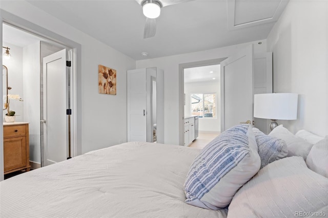 bedroom featuring ceiling fan and ensuite bath