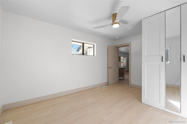 unfurnished room featuring ceiling fan and light wood-type flooring