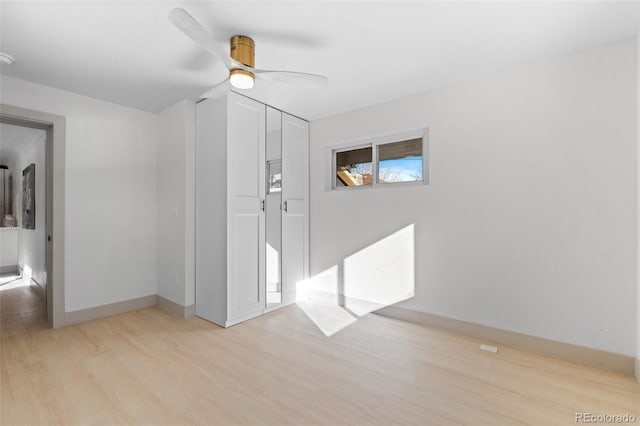 unfurnished room featuring light hardwood / wood-style flooring and ceiling fan