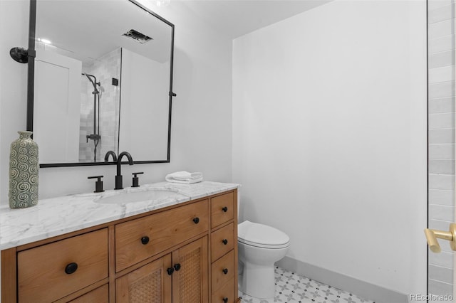 bathroom with vanity, toilet, and walk in shower