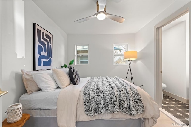 bedroom with ceiling fan and light wood-type flooring