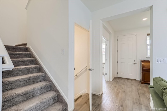 foyer entrance with light wood-type flooring