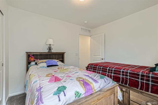 carpeted bedroom with a closet