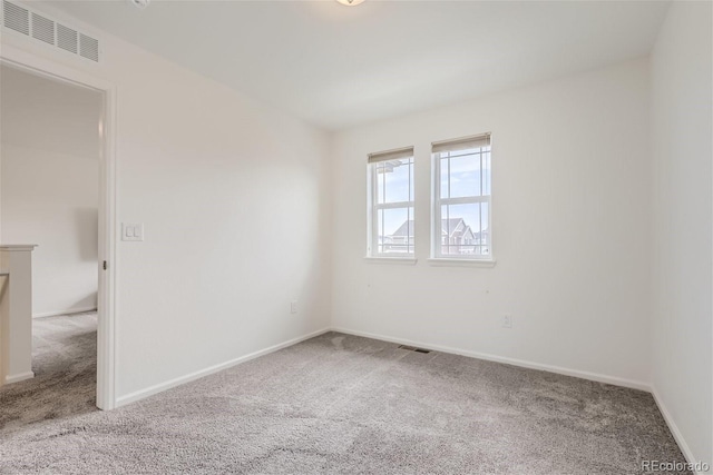 spare room featuring carpet flooring