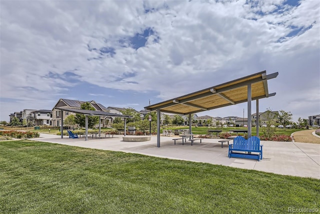 view of community featuring a patio area, a gazebo, and a yard