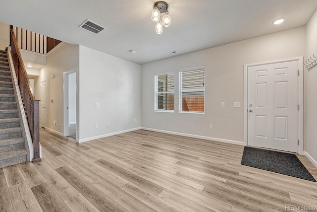 entrance foyer with light hardwood / wood-style flooring