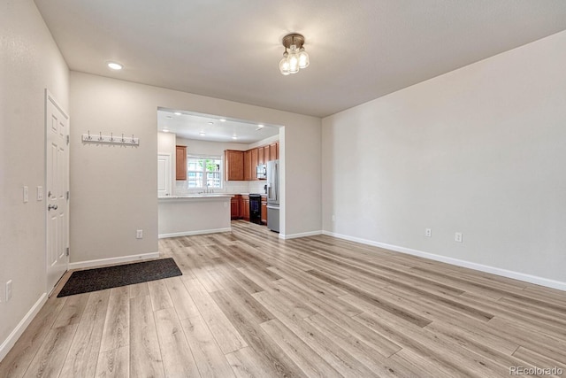 unfurnished living room featuring light hardwood / wood-style flooring