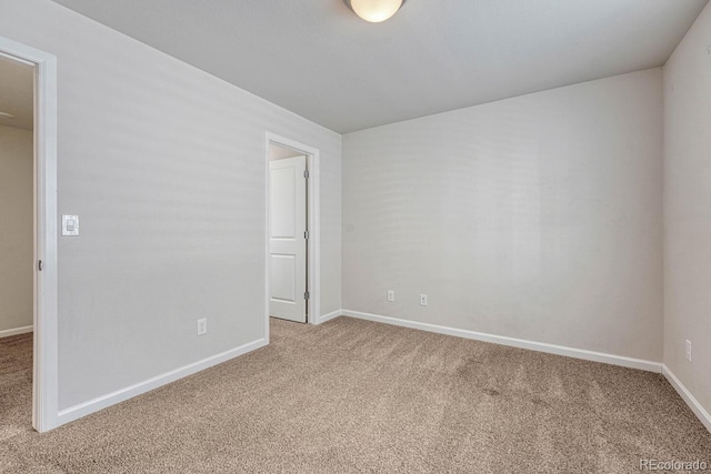 spare room featuring carpet flooring