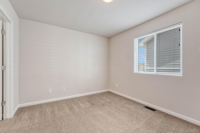 empty room with carpet flooring