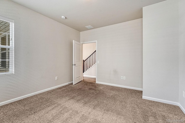 empty room with carpet flooring