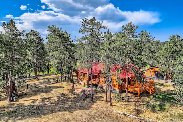 exterior space featuring a rural view and a deck